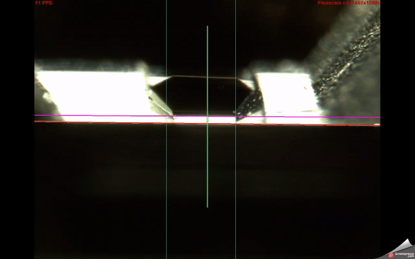 A black and white image of a black objectDescription automatically generated